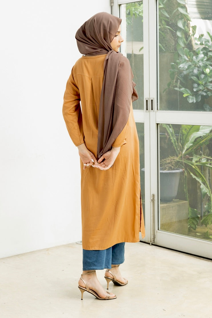 Naura- Elegant, long, golden yellow top with slit.