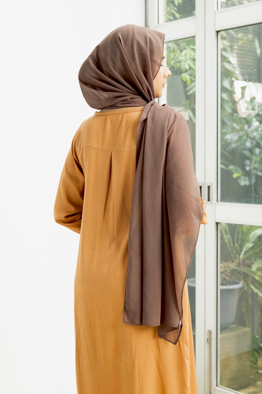 Naura- Elegant, long, golden yellow top with slit.