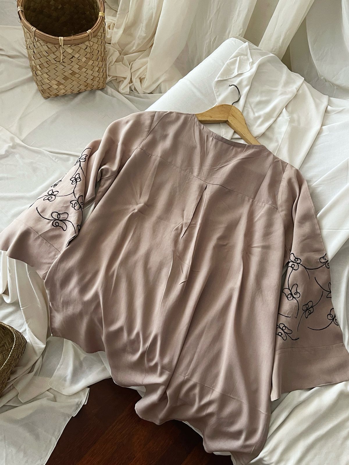 Nude top with black embroidery detail